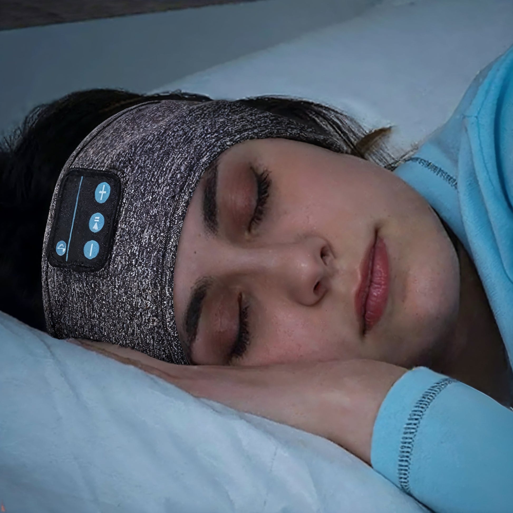 Woman relaxing with Slumber Seal sleep headband